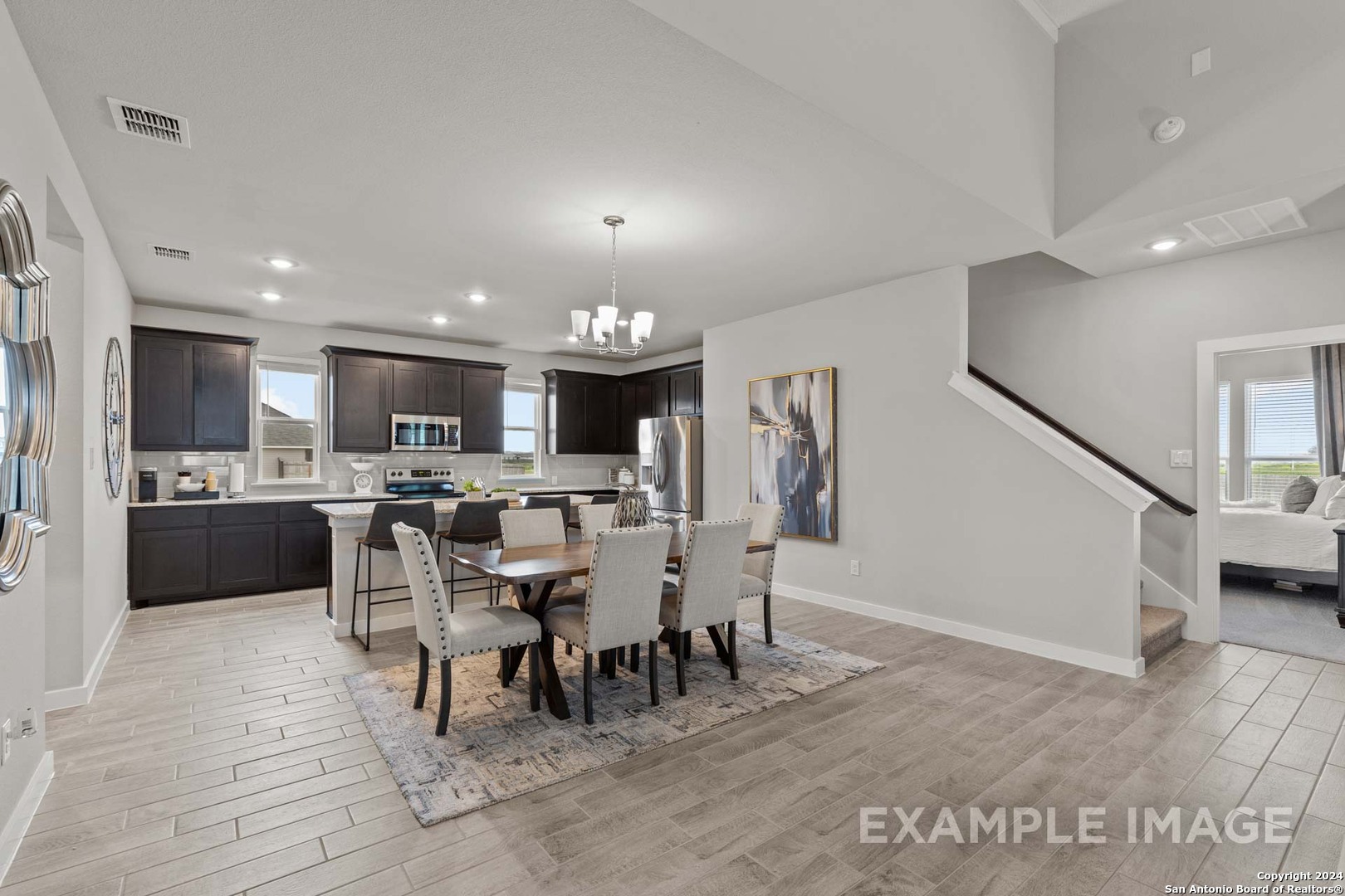 401 Tims Way Seguin, TX 78155 - Photo 10 of 50 a view of a dining area with furniture and a kitchen