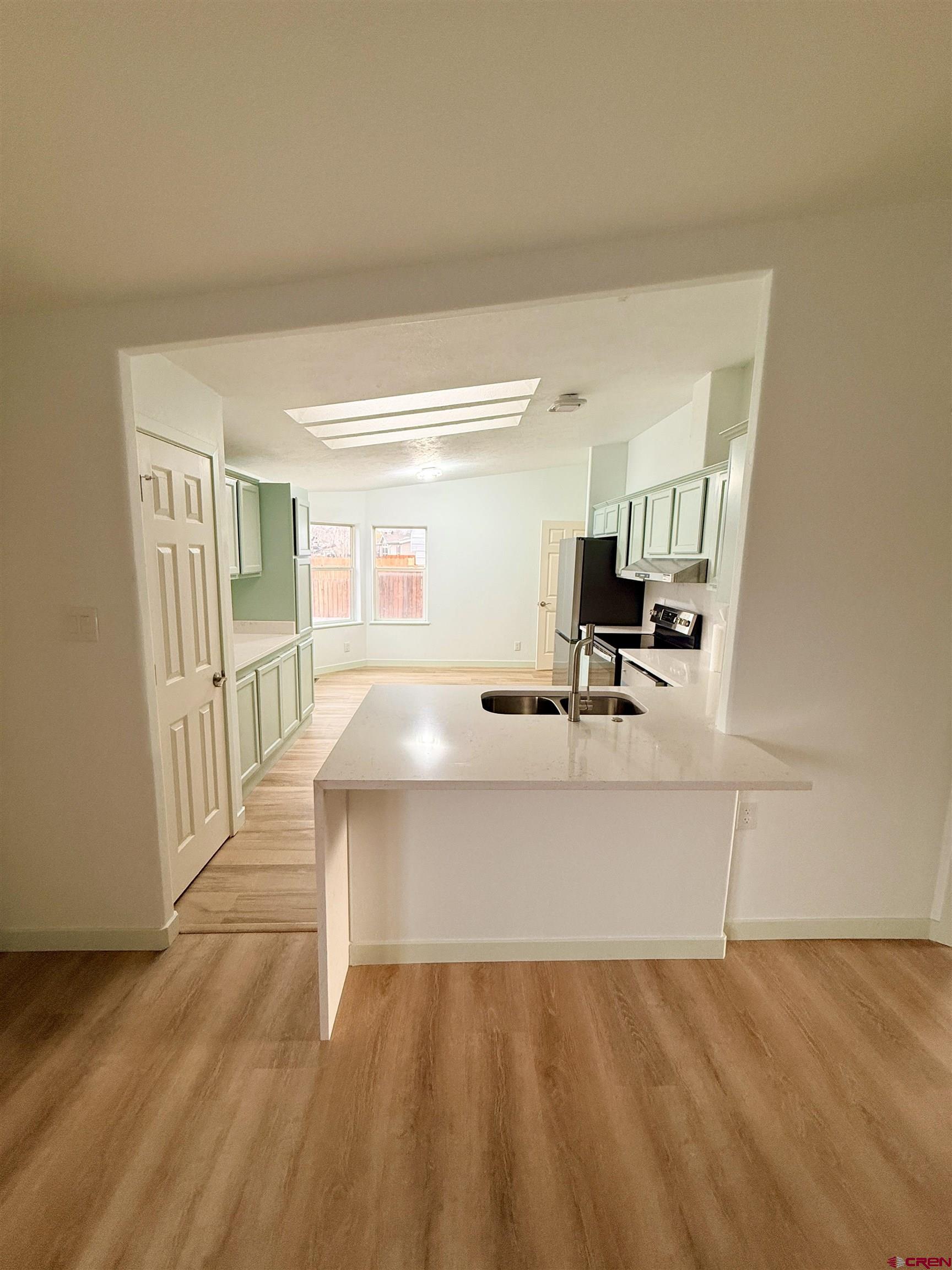 1278 Wagon Road Montrose, CO 81401 - Photo 11 of 17 View of the kitchen from the living room.