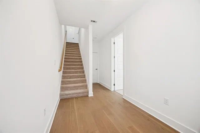 a view of a hallway with stairs