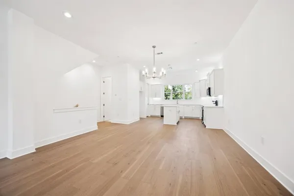 a view of a livingroom with a kitchen