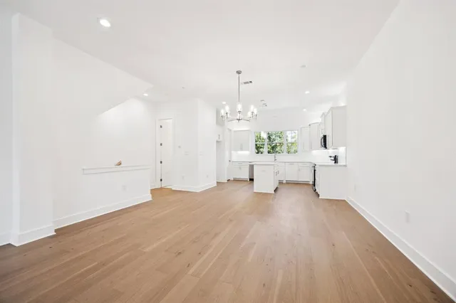 a view of a livingroom with a kitchen
