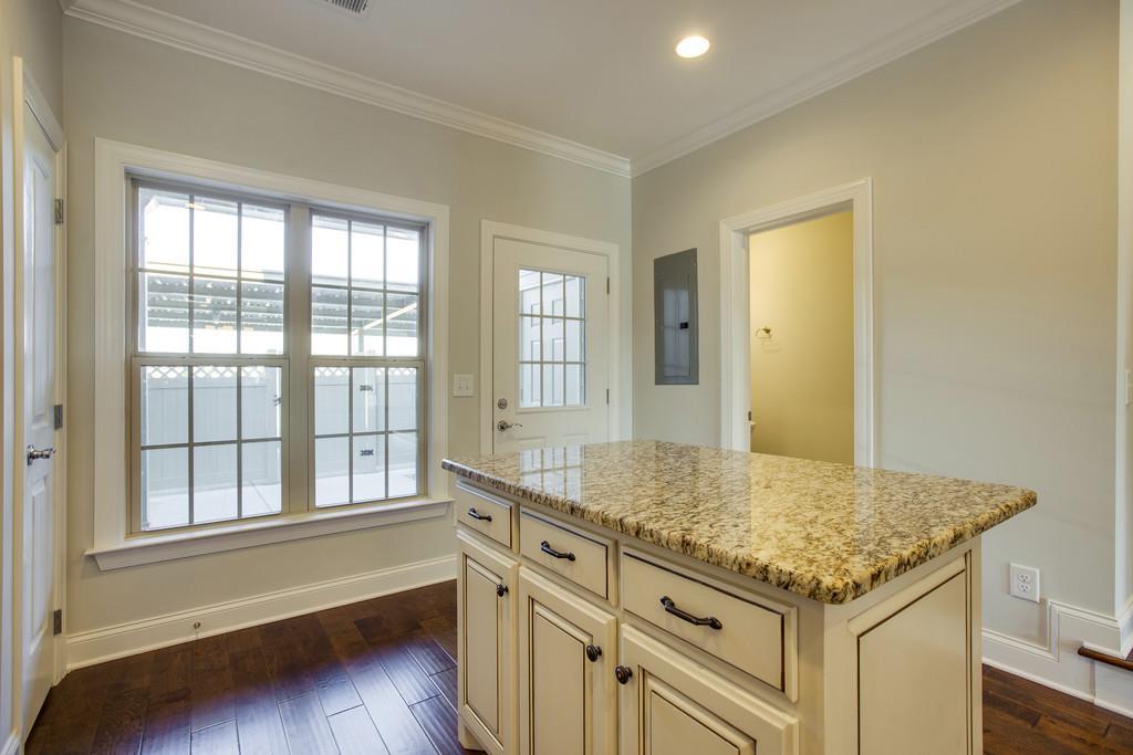 4325 Glassgow Road Spring Hill, TN 37174 - Photo 11 of 28 a kitchen with granite countertop sink and cabinets