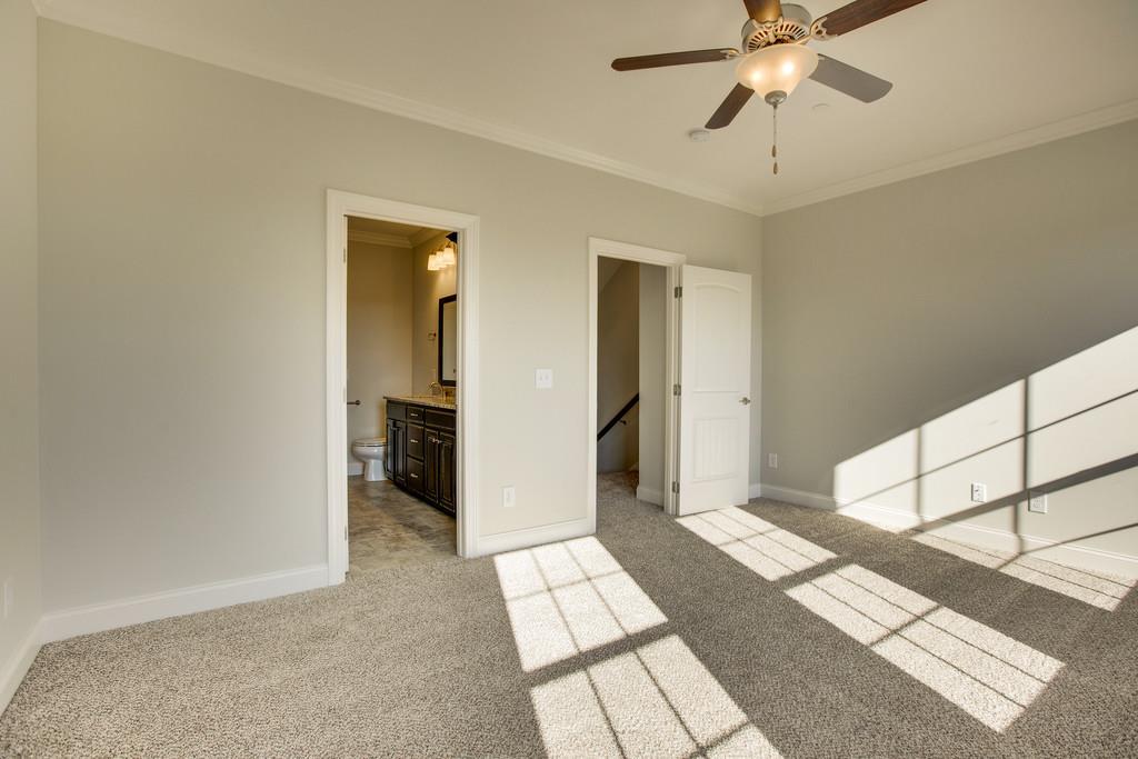 4325 Glassgow Road Spring Hill, TN 37174 - Photo 14 of 28 a view of a hallway with a chandelier