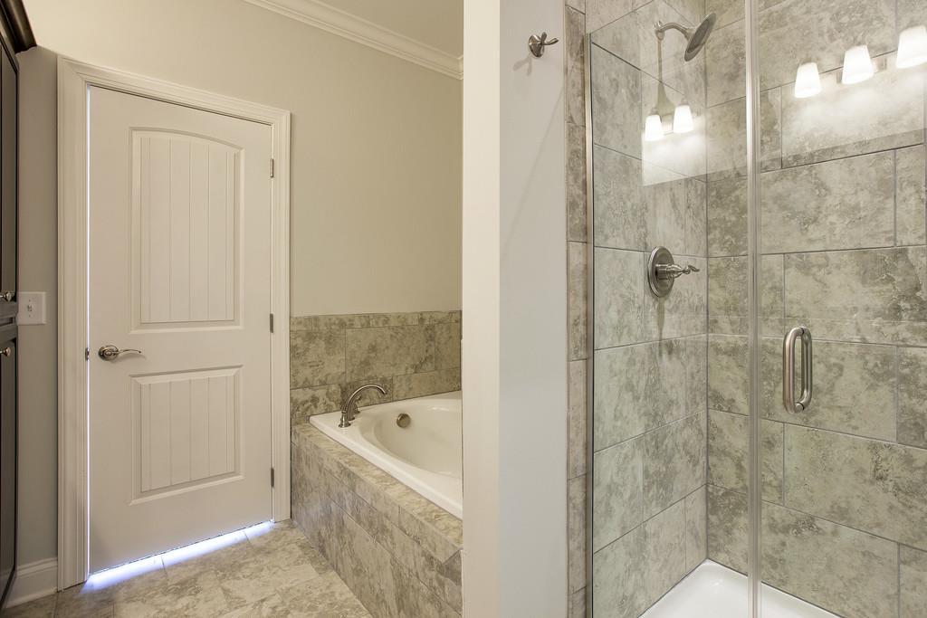 4325 Glassgow Road Spring Hill, TN 37174 - Photo 16 of 28 a bathroom with a bathtub and shower
