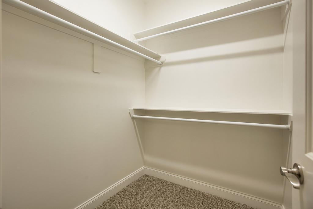 4325 Glassgow Road Spring Hill, TN 37174 - Photo 17 of 28 a view of a room with racks on the wall