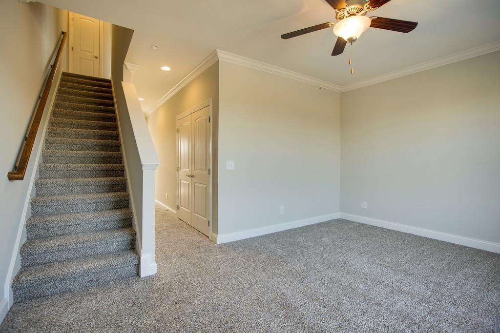 4325 Glassgow Road Spring Hill, TN 37174 - Photo 19 of 28 wooden floor in an empty room with a ceiling fan