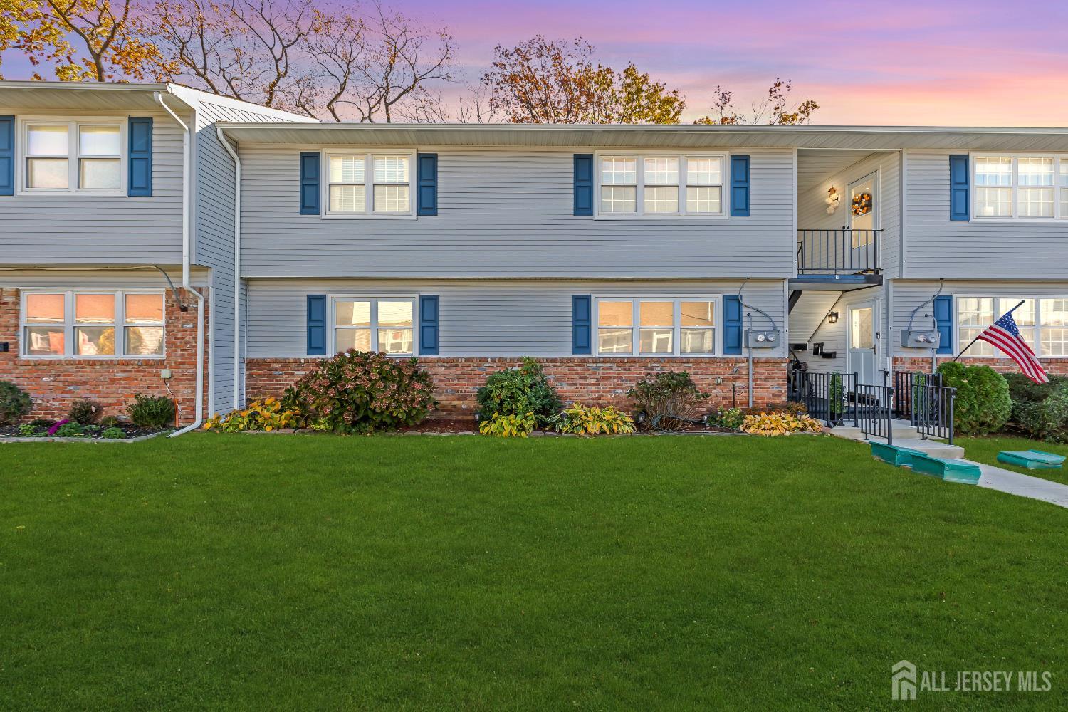 a brick house that is sitting in the grass