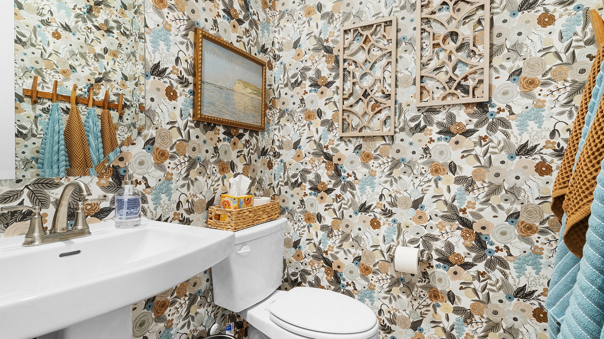 25812 Jasmine Sprig Lane Elgin, TX 78621 - Photo 4 of 33 Bold floral wallpaper enlivens this compact, well-appointed half bath.