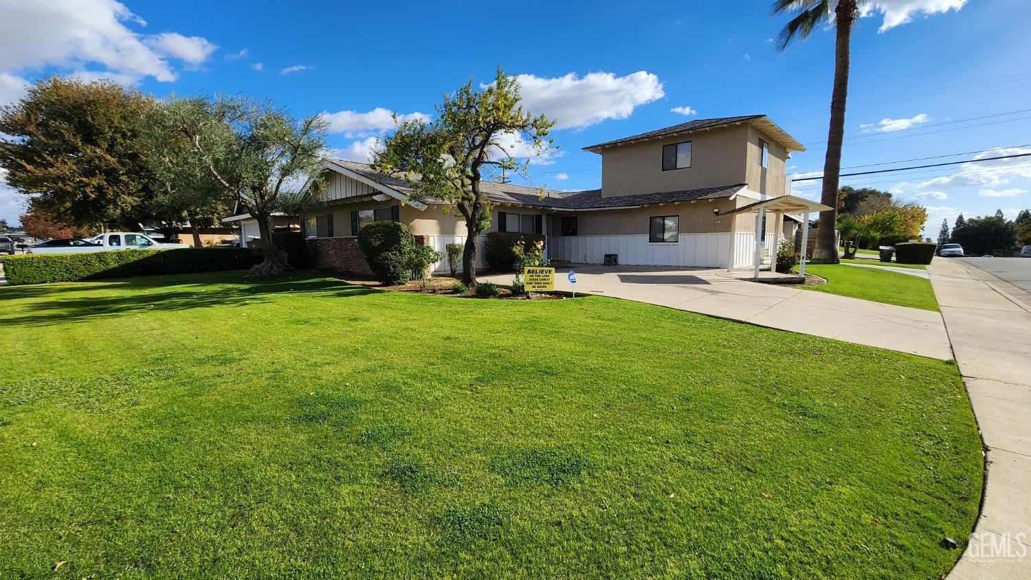 Undisclosed Address Bakersfield, CA 93306 - Photo 1 of 20 a view of a house with a back yard and a patio