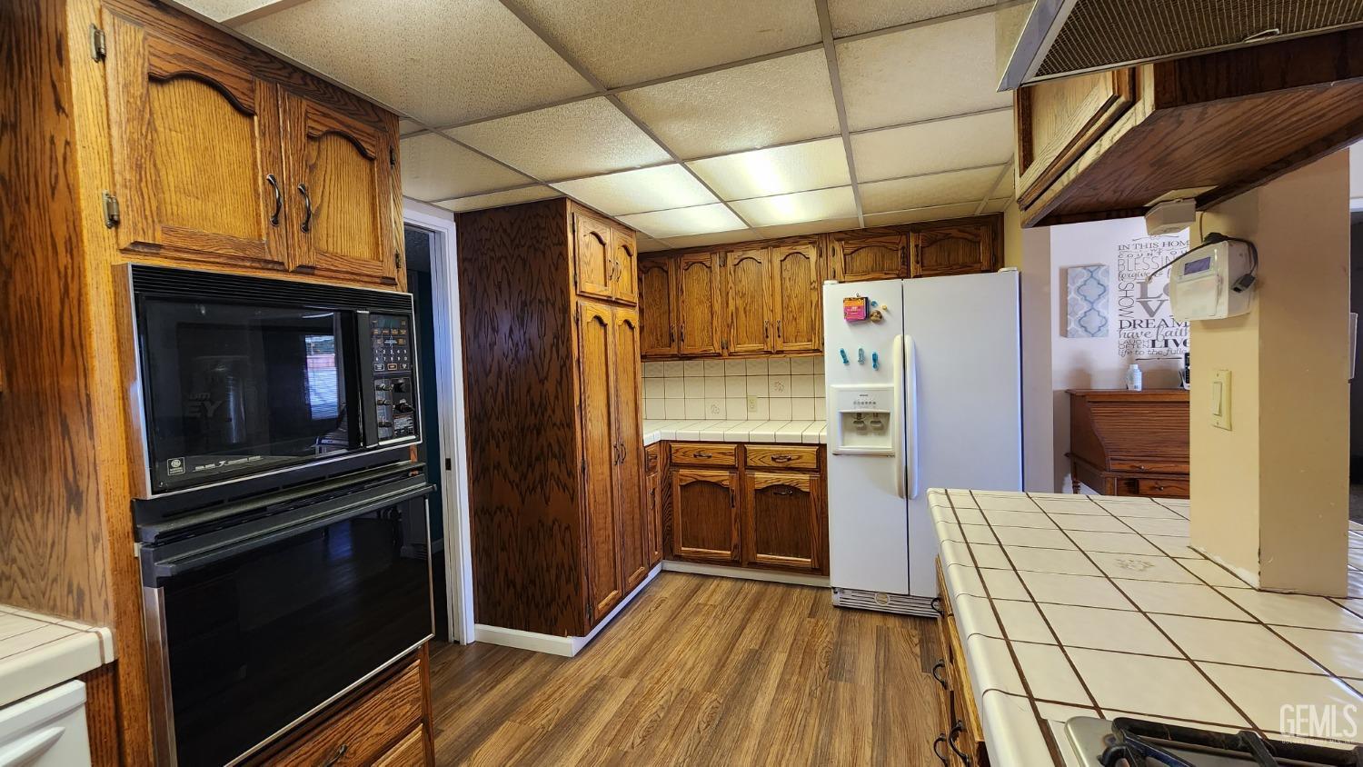 Undisclosed Address Bakersfield, CA 93306 - Photo 12 of 20 a kitchen with stainless steel appliances granite countertop a refrigerator and a stove