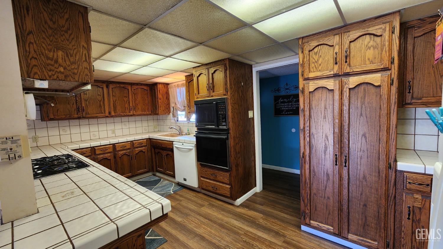 Undisclosed Address Bakersfield, CA 93306 - Photo 13 of 20 a kitchen with stainless steel appliances granite countertop a refrigerator and a stove top oven