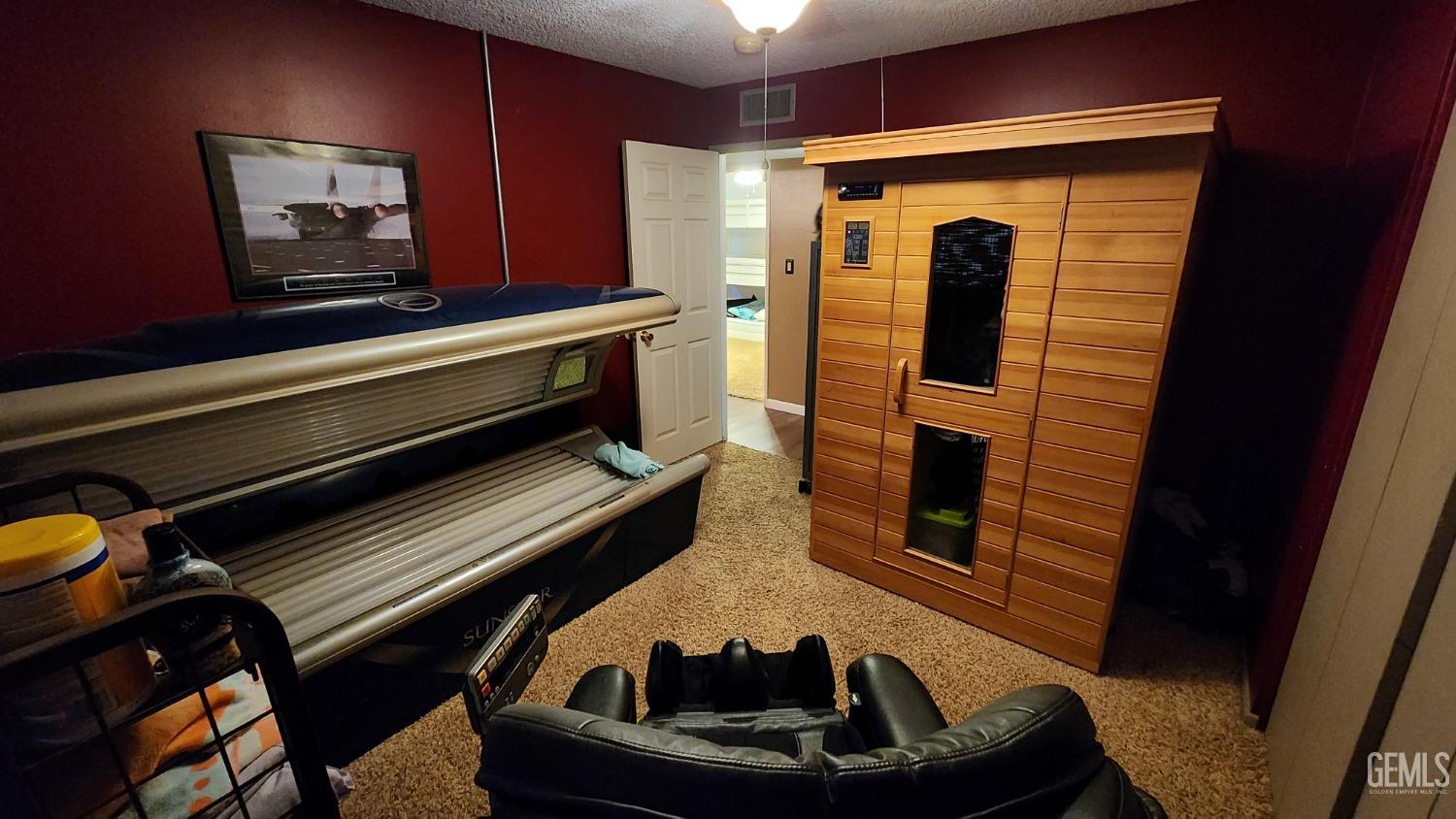 Undisclosed Address Bakersfield, CA 93306 - Photo 17 of 20 a living room with furniture and a fireplace