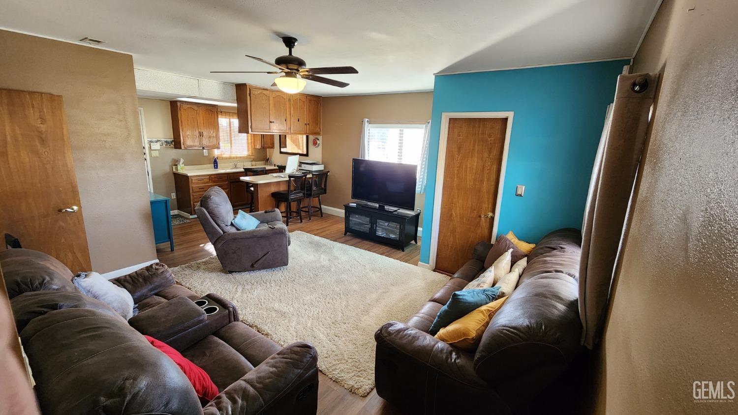 Undisclosed Address Bakersfield, CA 93306 - Photo 7 of 20 a living room with furniture and a flat screen tv