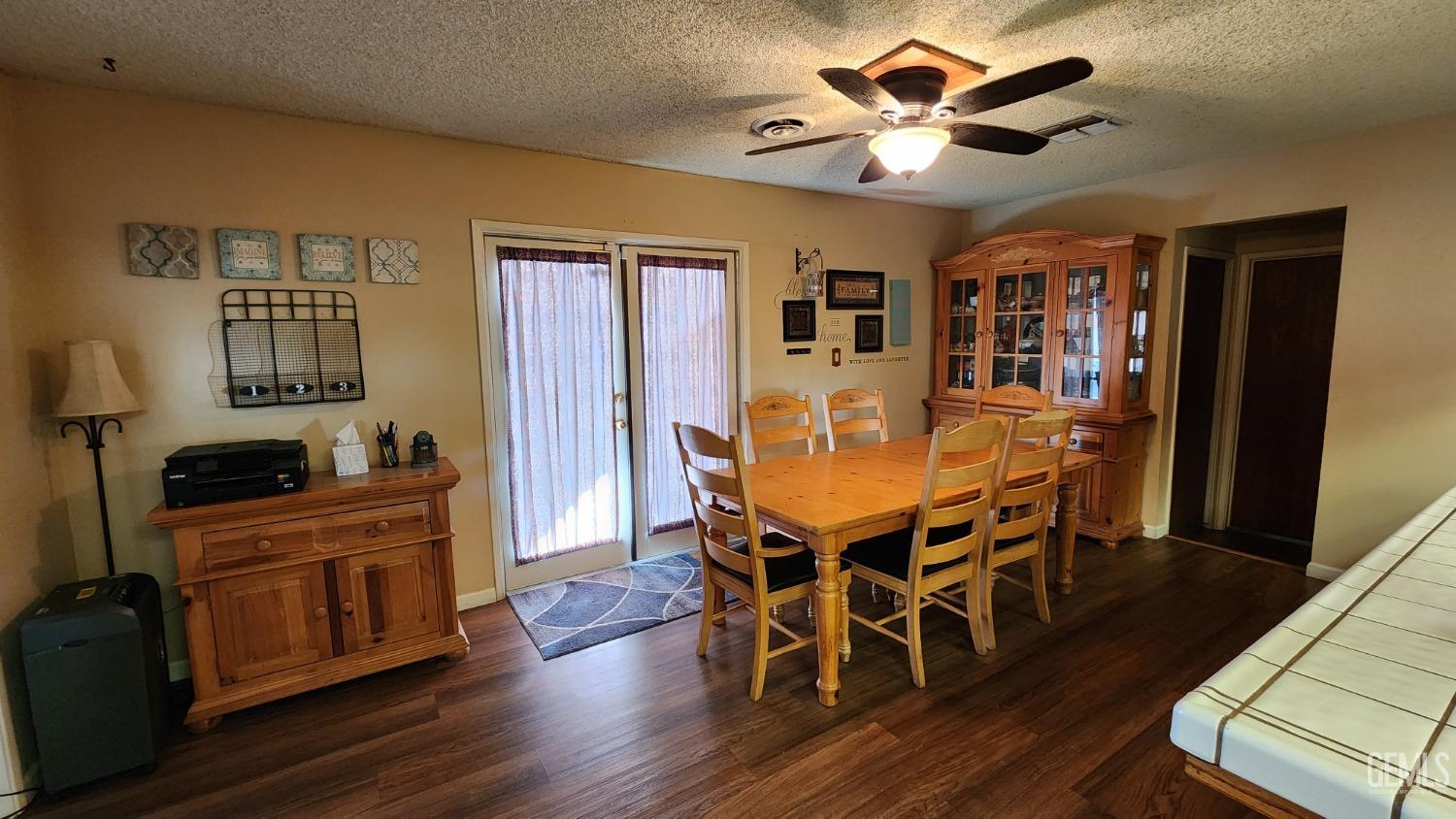 Undisclosed Address Bakersfield, CA 93306 - Photo 10 of 20 a dining room with furniture a chandelier and wooden floor