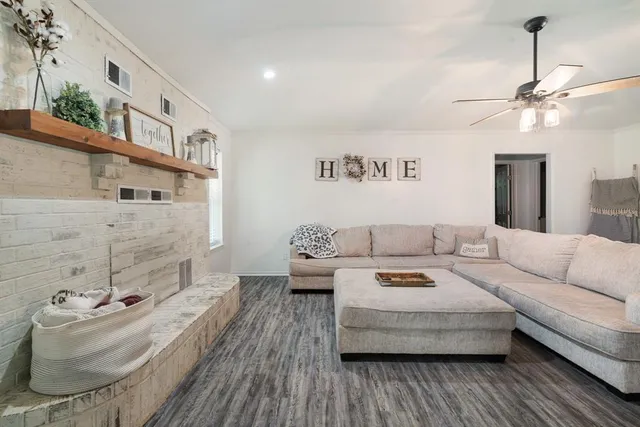 a living room with furniture and a fireplace