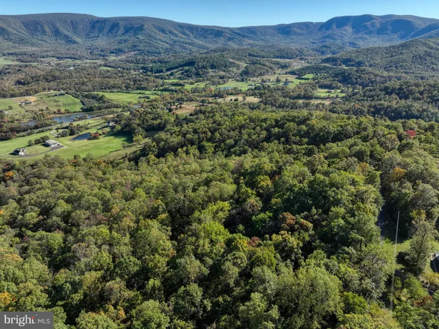 a view of a city with mountains in the background