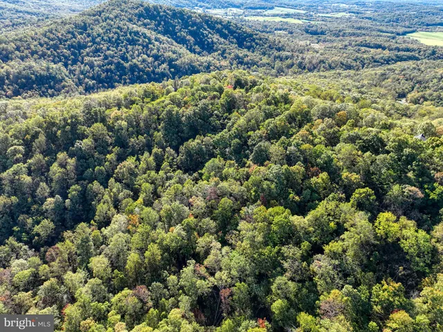 a view of an ocean and mountain