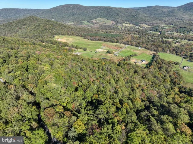 a view of a city with mountains in the background