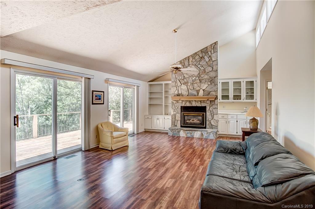 31002 Executive Point Tega Cay, SC 29708 - Photo 7 of 28 a living room with furniture and a fireplace