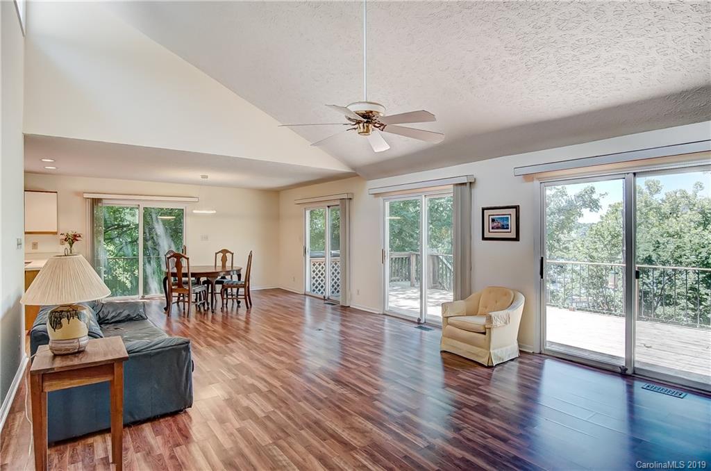 31002 Executive Point Tega Cay, SC 29708 - Photo 8 of 28 a living room with furniture and a large window