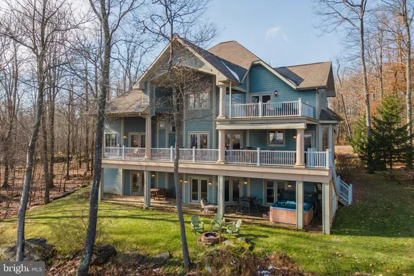 a view of a house with yard and sitting area