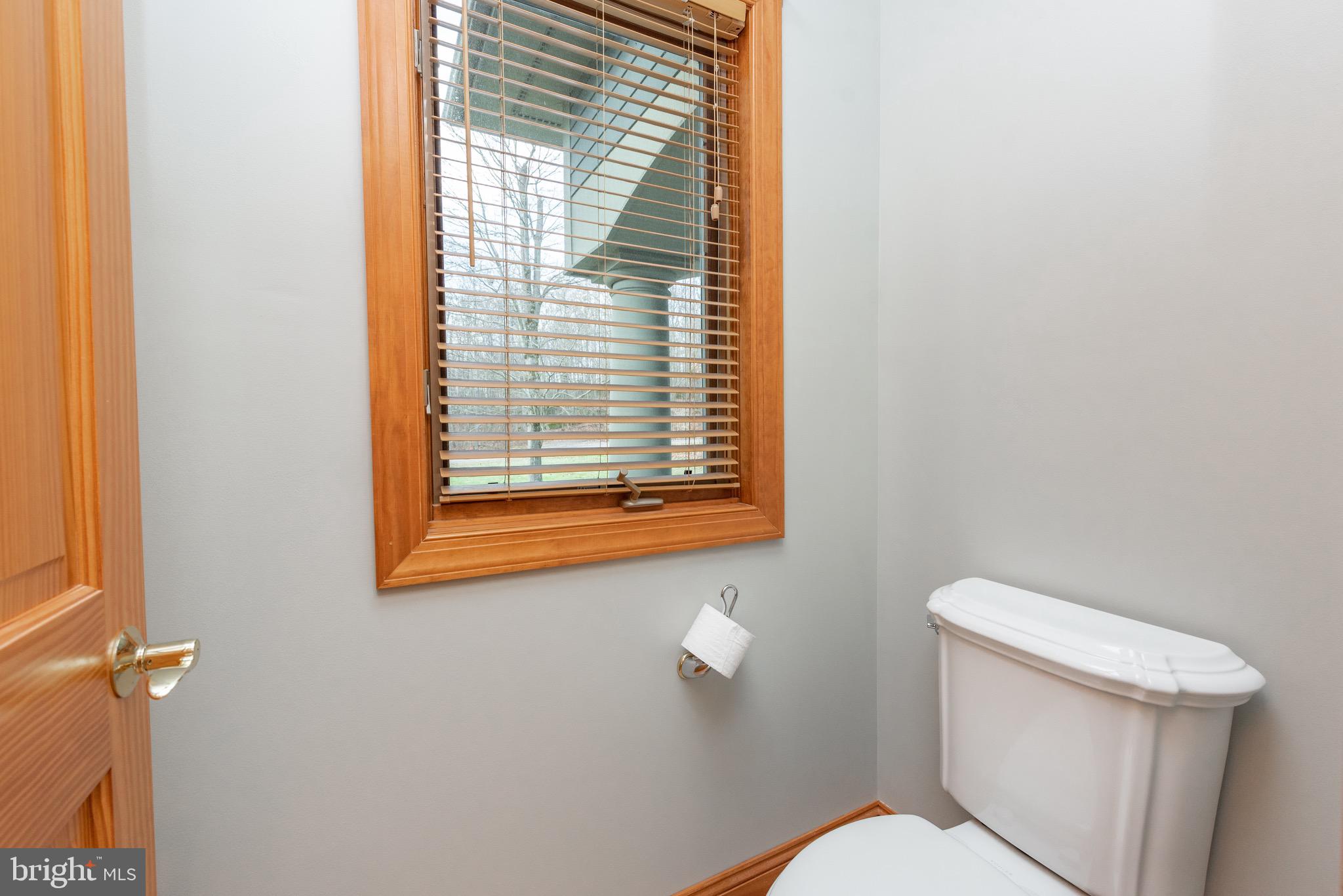 38 Parkside Court North McHenry, MD 21541 - Photo 41 of 60 a white toilet sitting next to a window