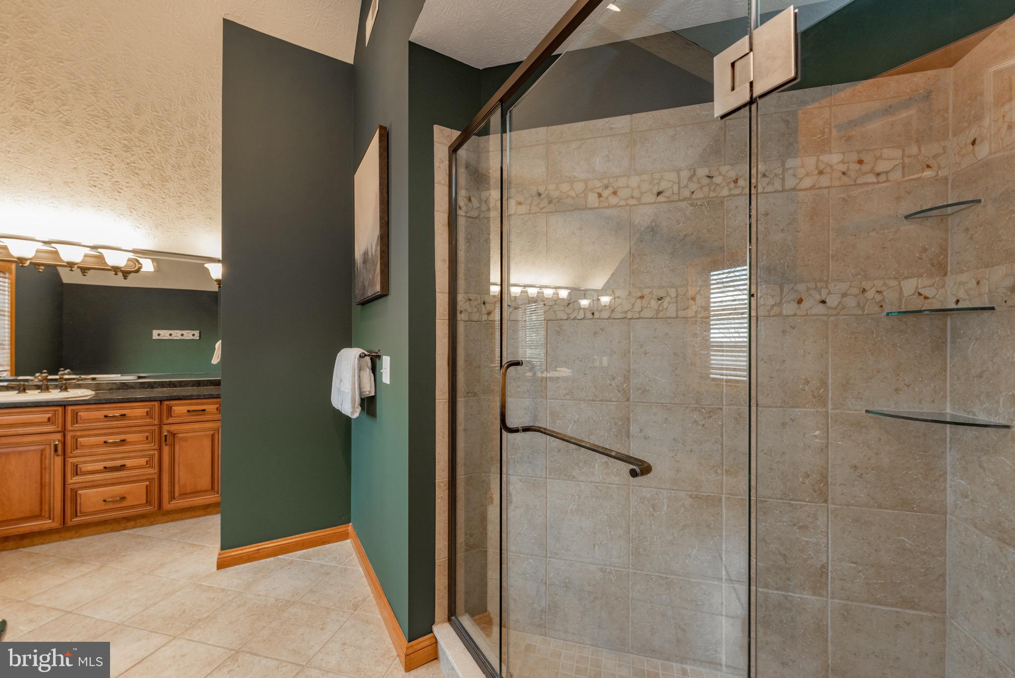 38 Parkside Court North McHenry, MD 21541 - Photo 46 of 60 a bathroom with a granite countertop shower mirror and a sink