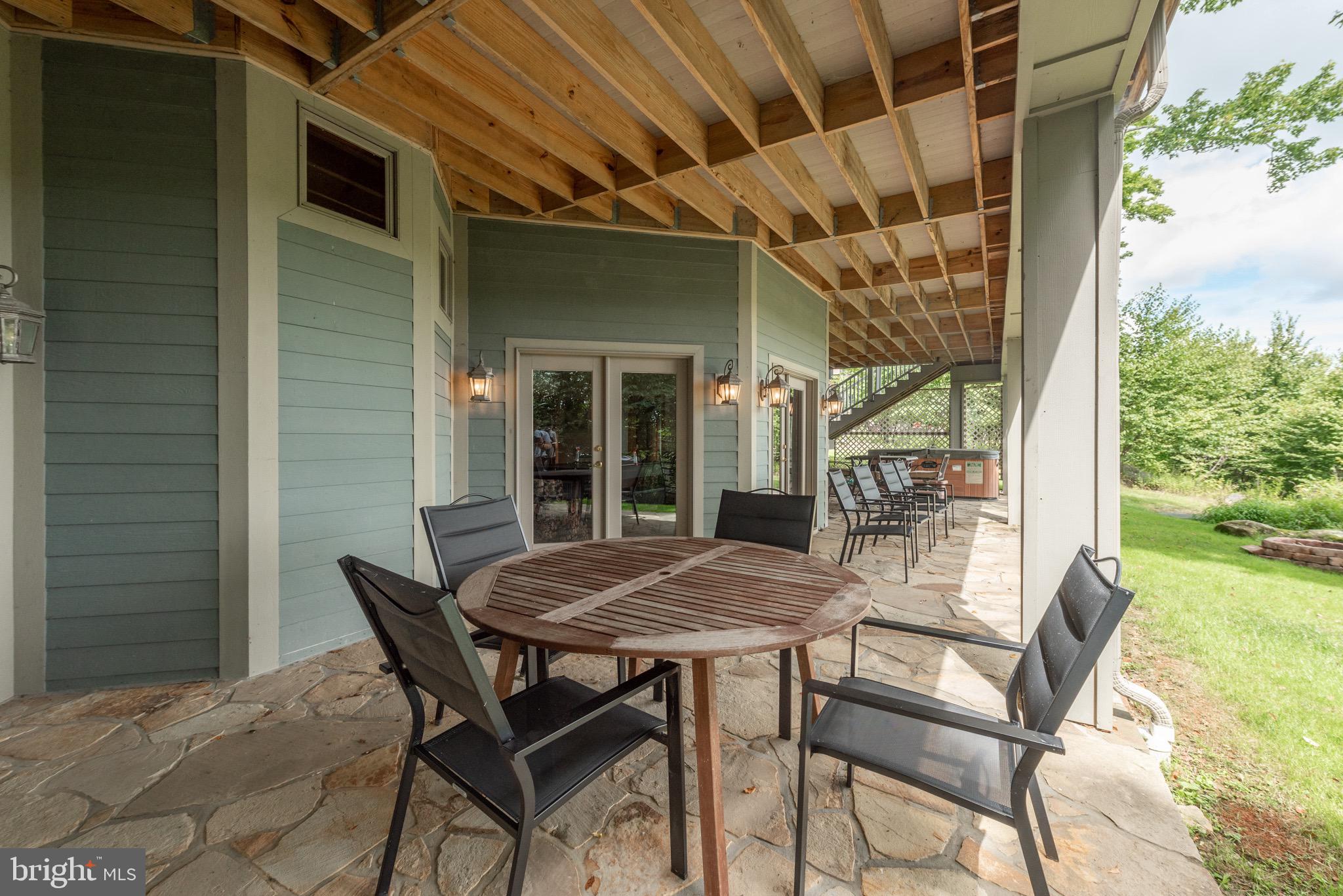 38 Parkside Court North McHenry, MD 21541 - Photo 54 of 60 a view of an outside dining space with a table and chairs