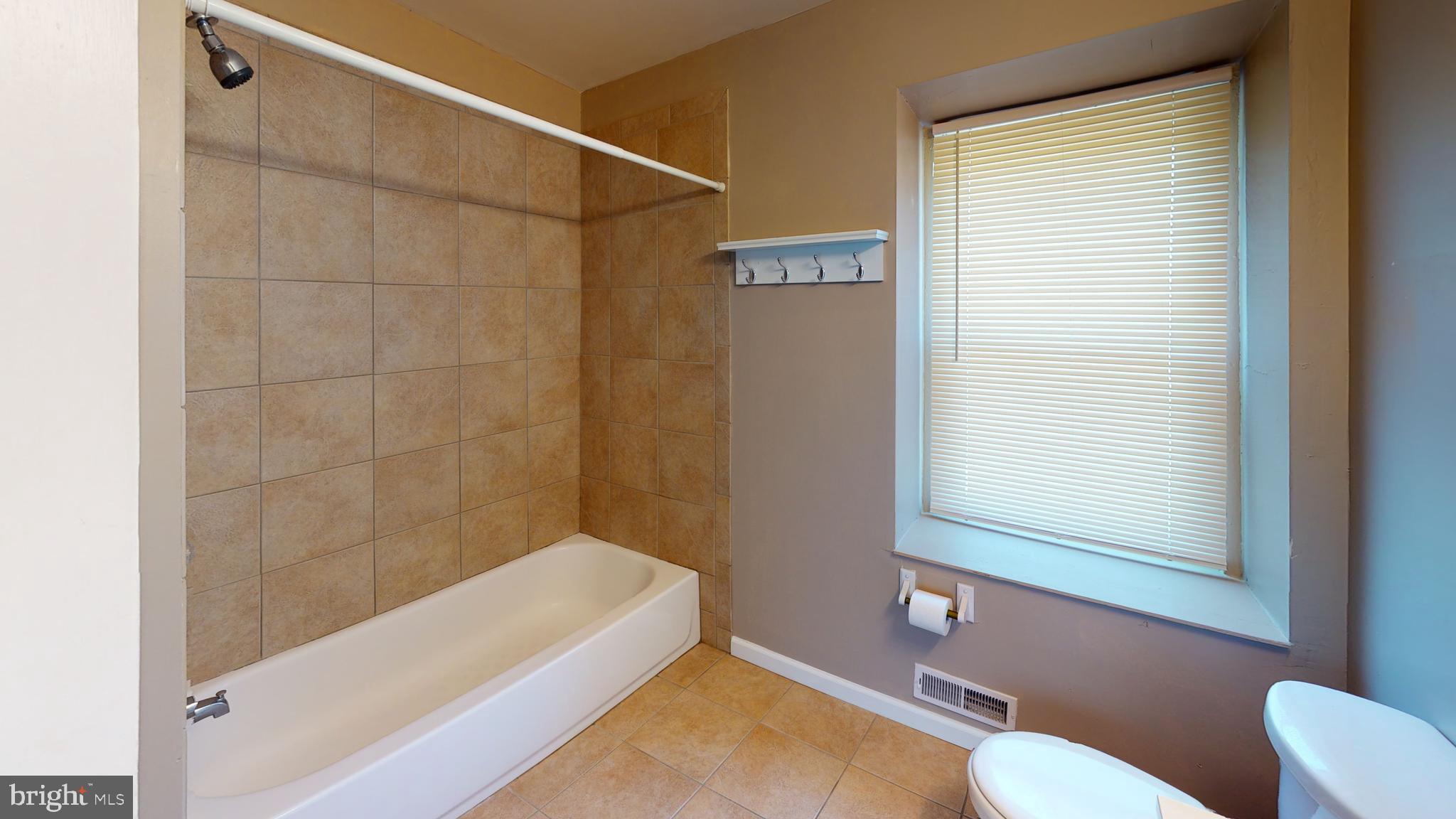 211 Front Street, Unit 3 Bordentown, NJ 08505 - Photo 5 of 9 a bathroom with a tub and a shower
