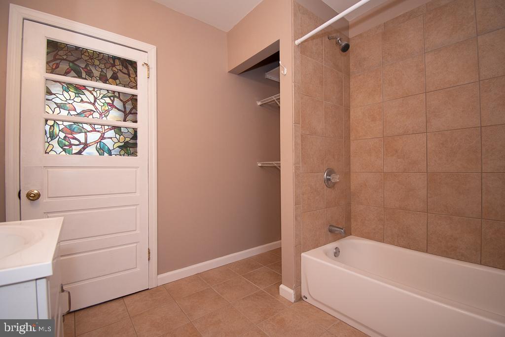 211 Front Street, Unit 3 Bordentown, NJ 08505 - Photo 7 of 9 a bathroom with a bathtub a toilet and a shower
