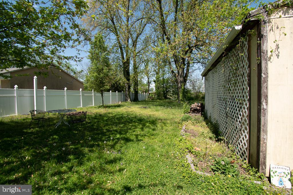 211 Front Street, Unit 3 Bordentown, NJ 08505 - Photo 9 of 9 a view of a yard with plants and tree
