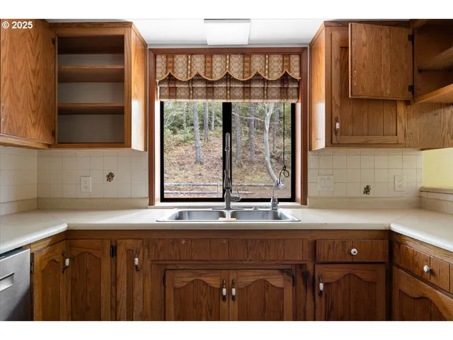 a kitchen with a sink and a window