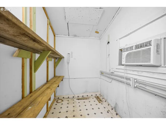 a bathroom with a sink a toilet and a window