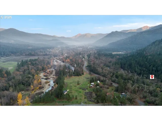 a open area with mountains in the background