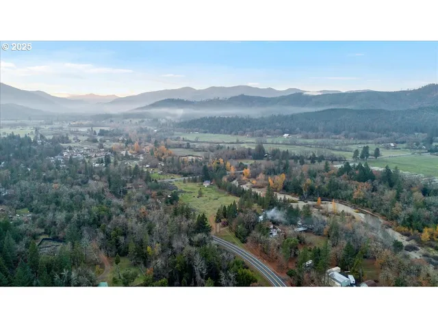 a open area with mountains in the background