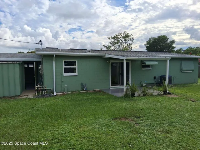a kitchen with a sink a window and stainless steel appliances