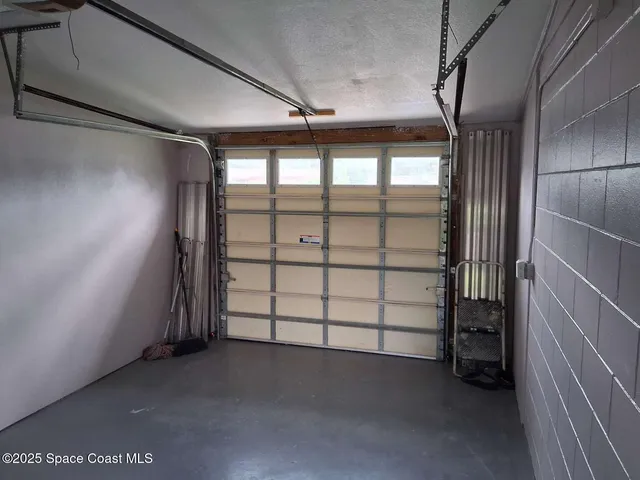 a view of a backyard with a tree