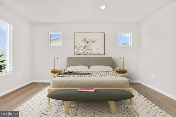 a bedroom with bed and a window