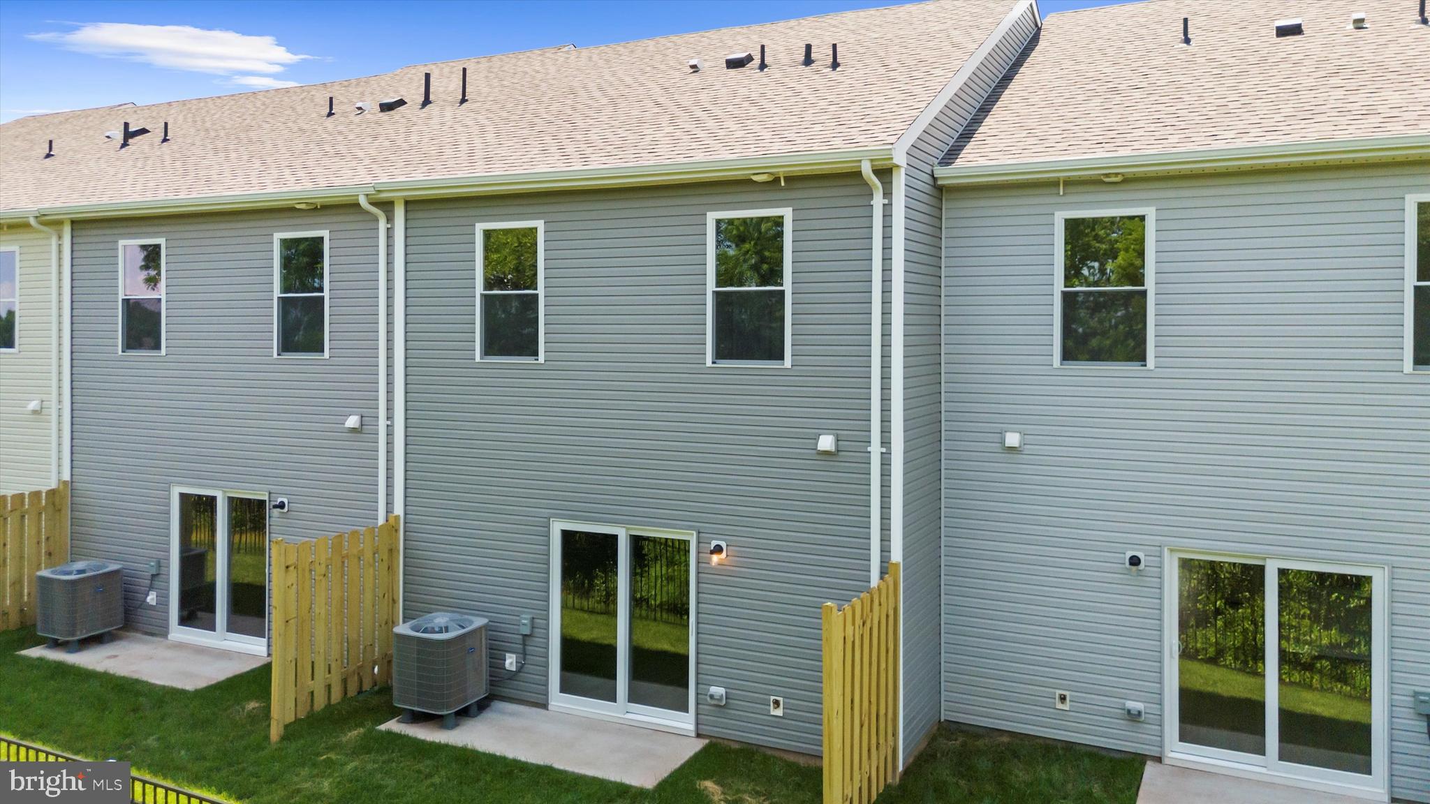 8141 Bartholomew Court Baltimore, MD 21206 - Photo 6 of 18 a front view of a house with a garden