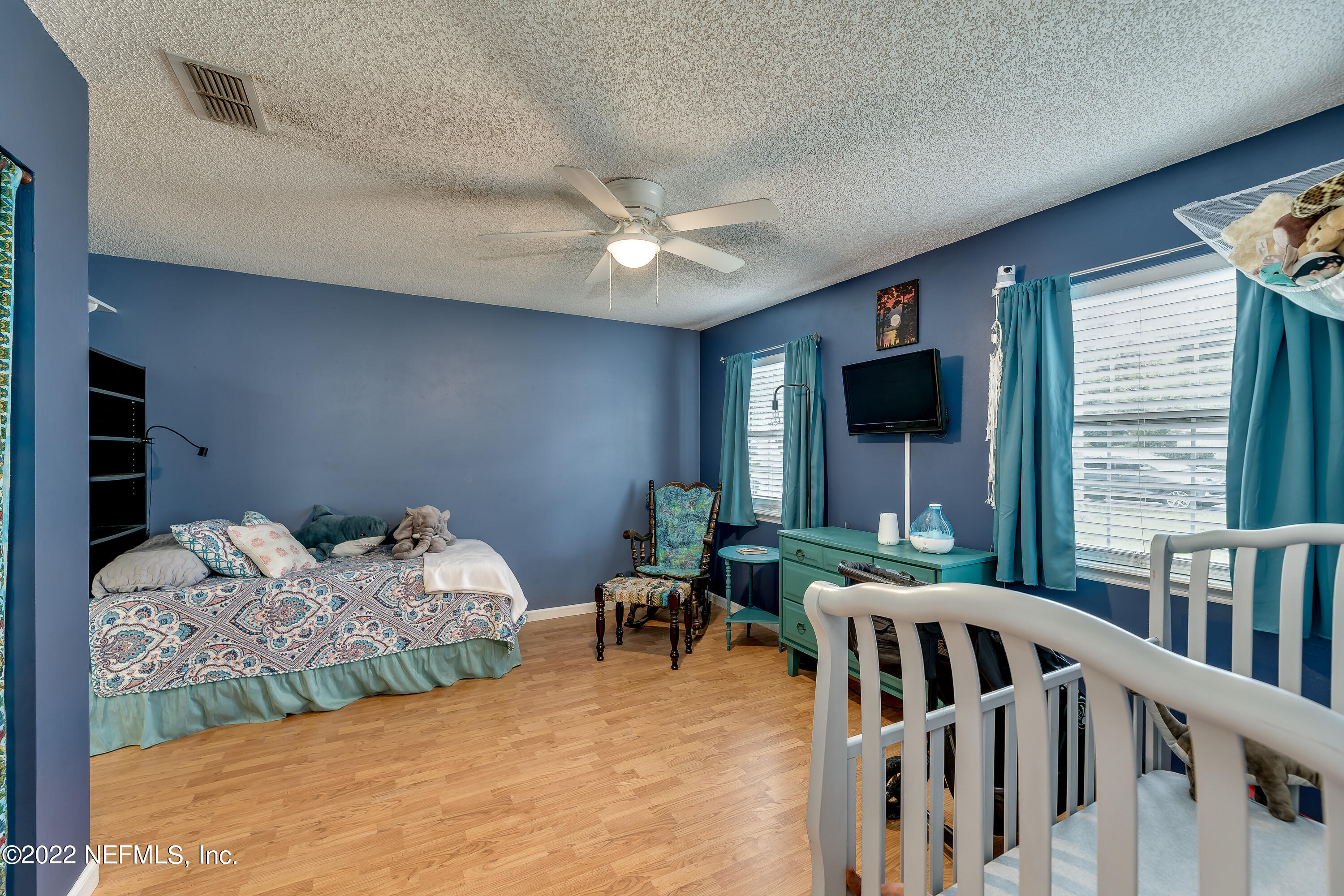 12743 Beaubien Road Jacksonville, FL 32258 - Photo 19 of 28 a bedroom with furniture and a large window
