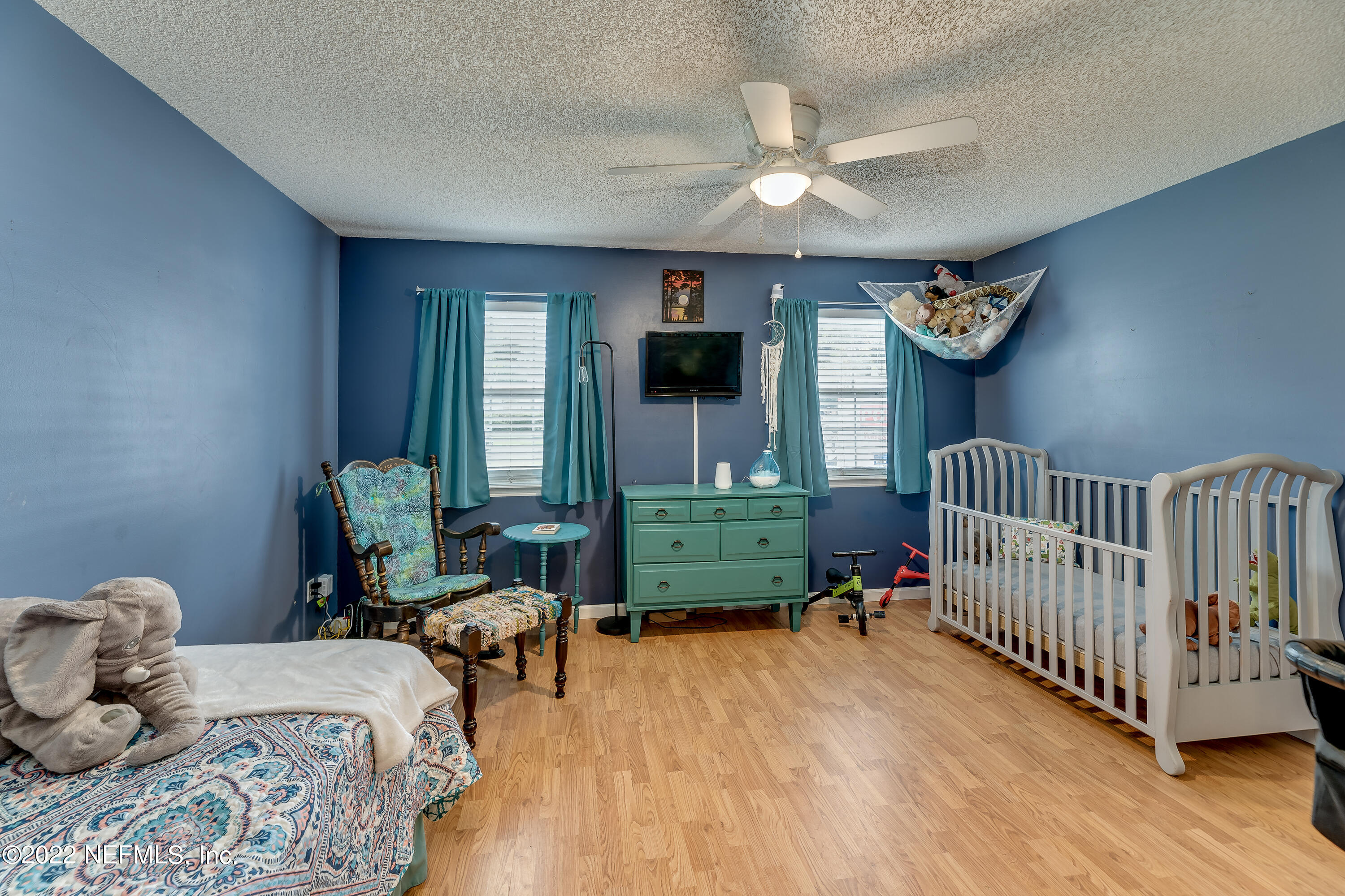 12743 Beaubien Road Jacksonville, FL 32258 - Photo 21 of 28 a bedroom with furniture and a large window