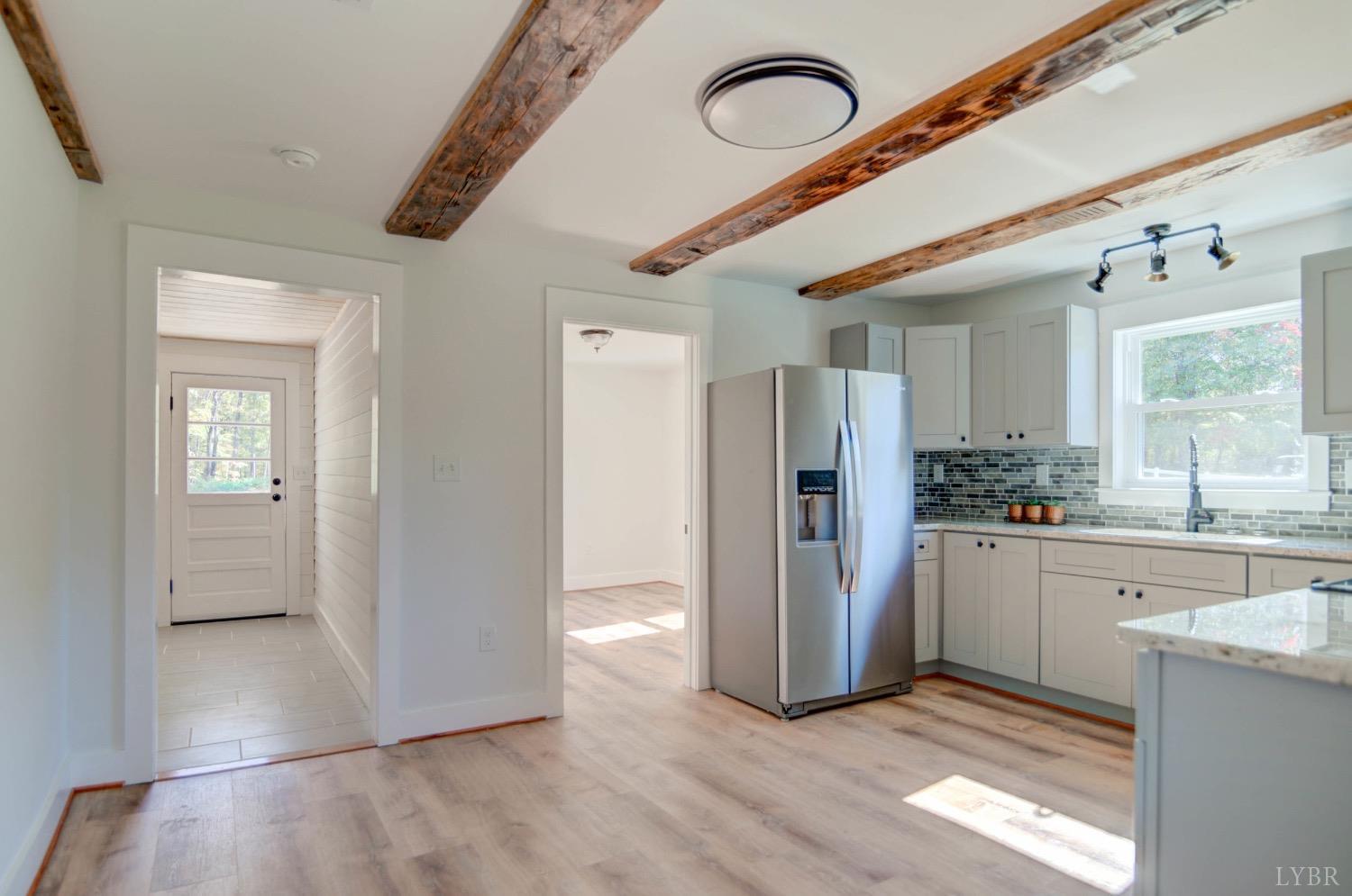 234 Baileys Sawmill Road Amherst, VA 24521 - Photo 18 of 32 a kitchen with refrigerator and window