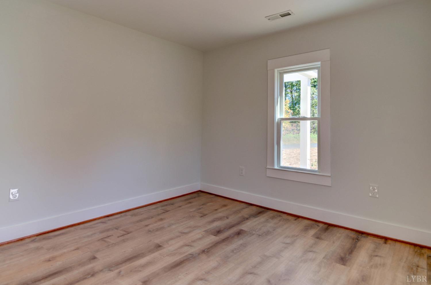 234 Baileys Sawmill Road Amherst, VA 24521 - Photo 19 of 32 an empty room with a window