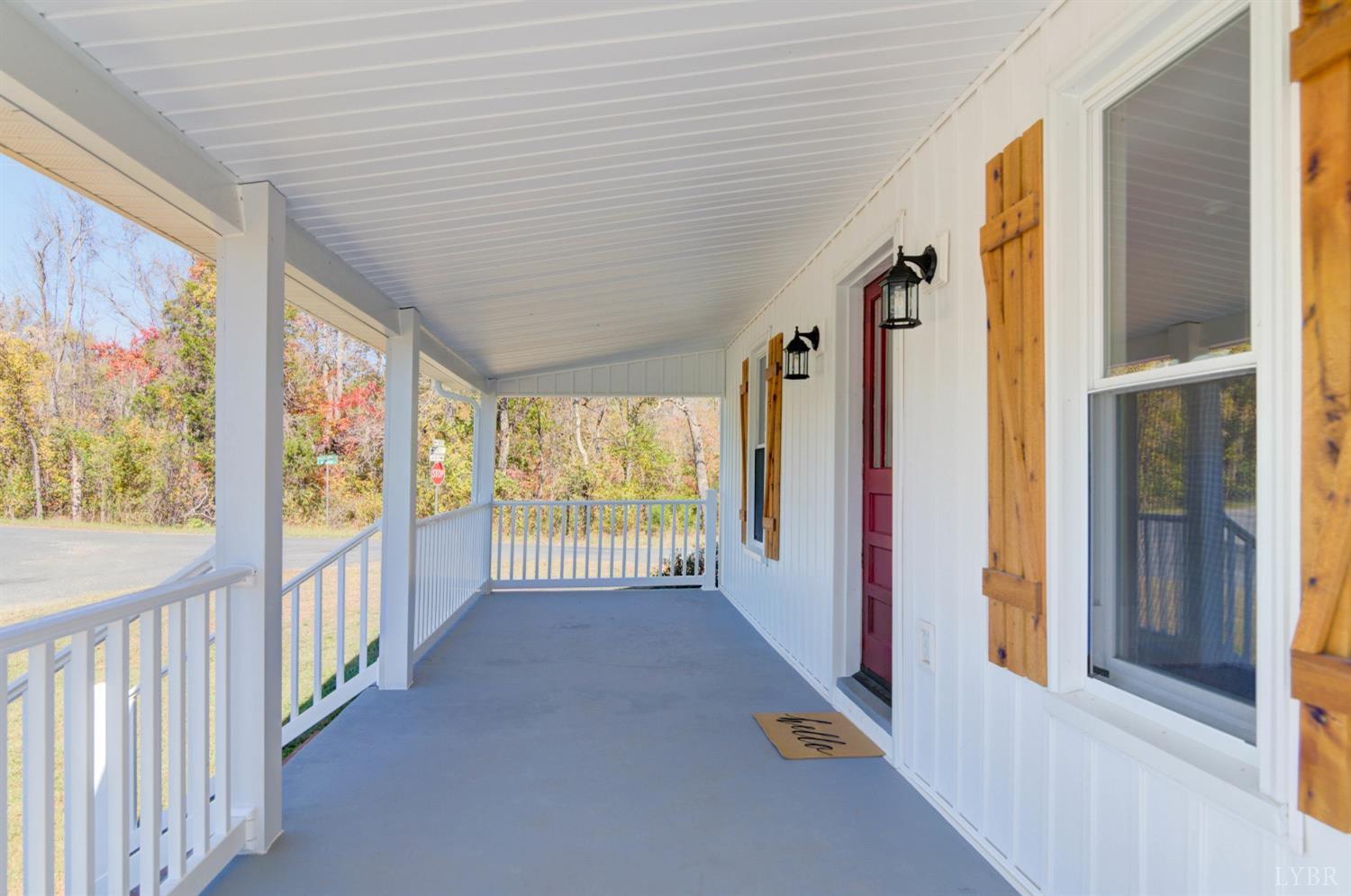 234 Baileys Sawmill Road Amherst, VA 24521 - Photo 4 of 32 a view of a hallway with wooden floor and windows