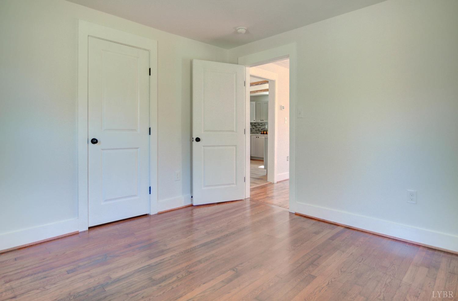 234 Baileys Sawmill Road Amherst, VA 24521 - Photo 10 of 32 a view of an empty room and wooden floor