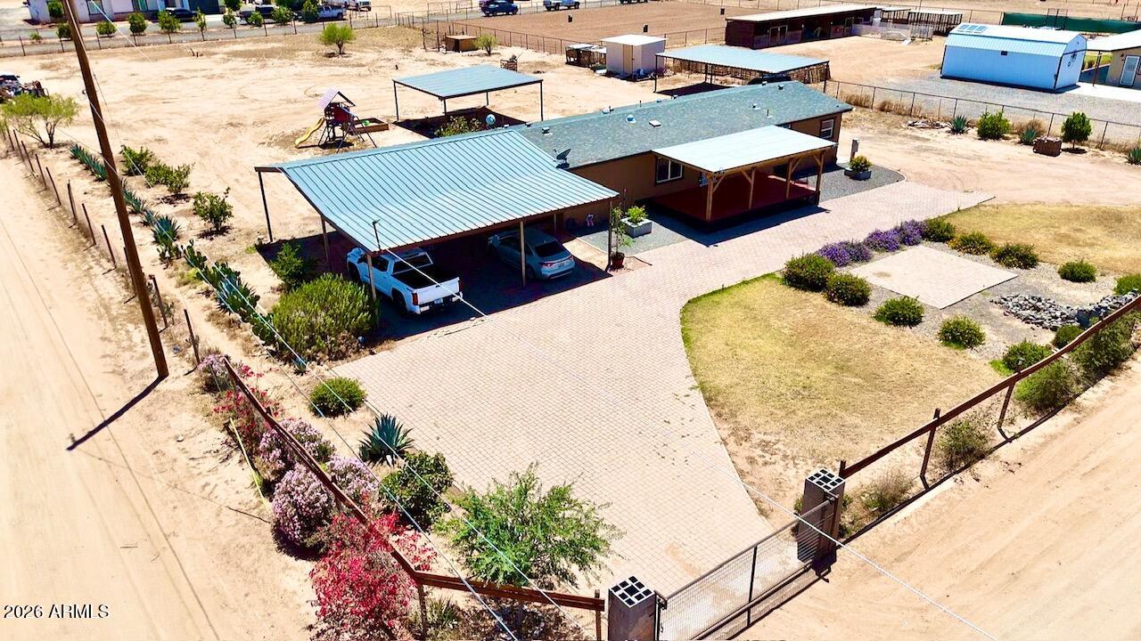 an aerial view of a house with a yard