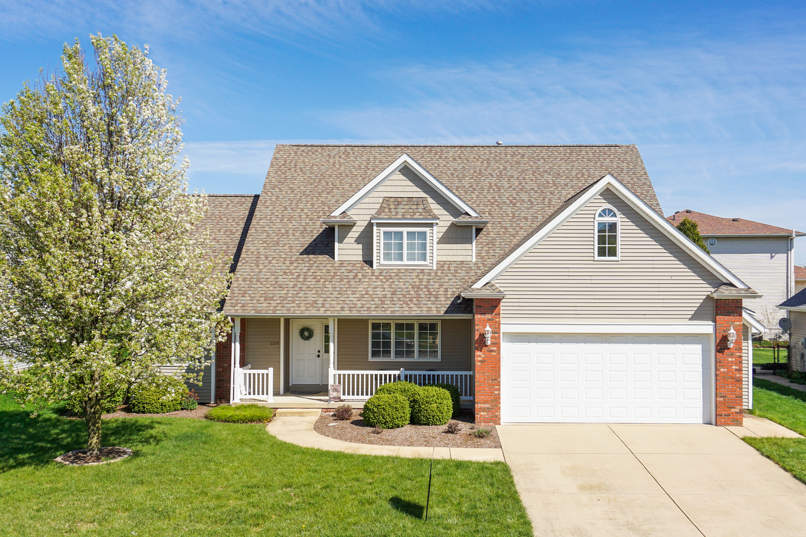 2374 Heather Ridge Drive Normal, IL 61761 - Photo 1 of 31 a front view of a house with a yard