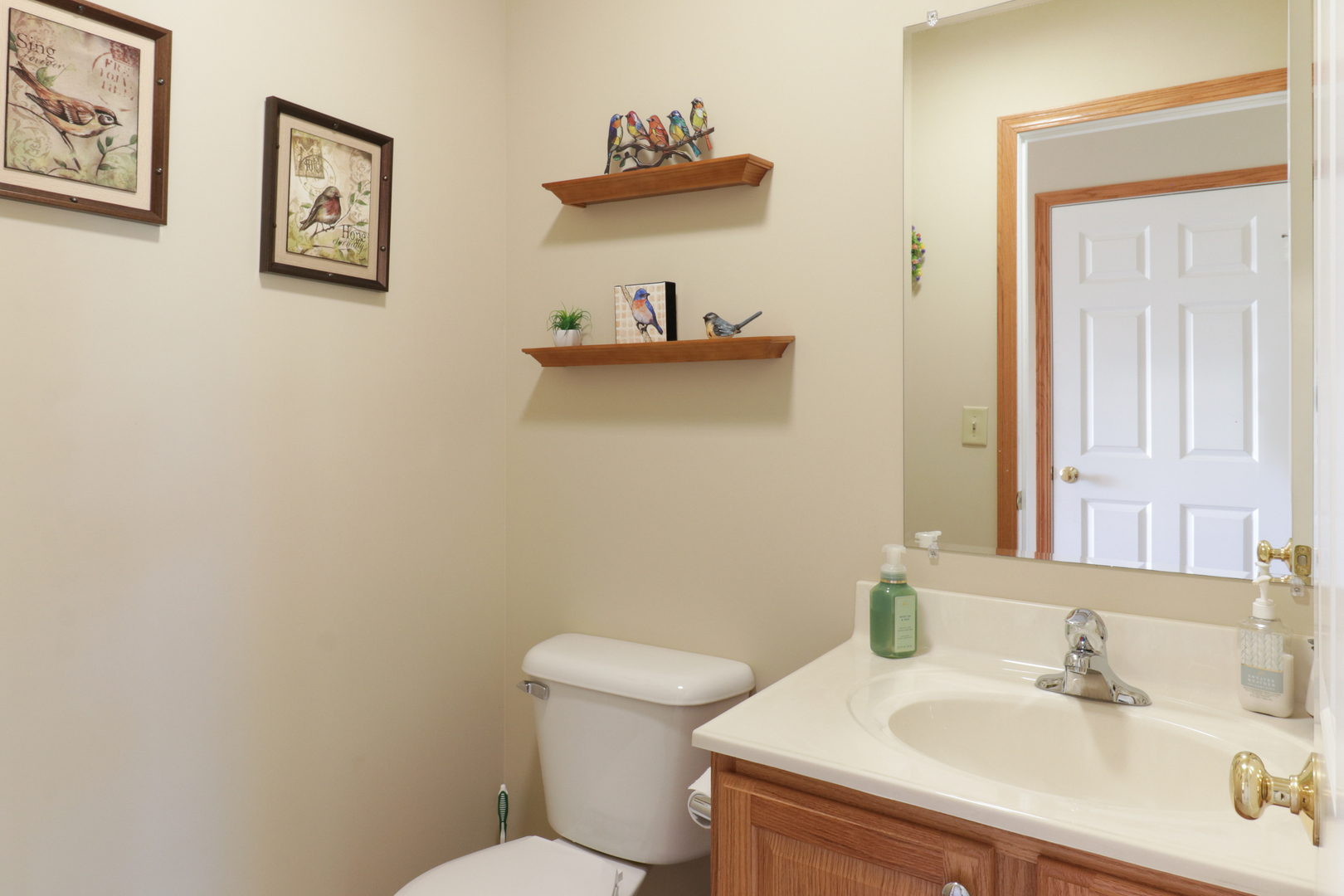 2374 Heather Ridge Drive Normal, IL 61761 - Photo 13 of 31 a bathroom with a sink mirror and toilet
