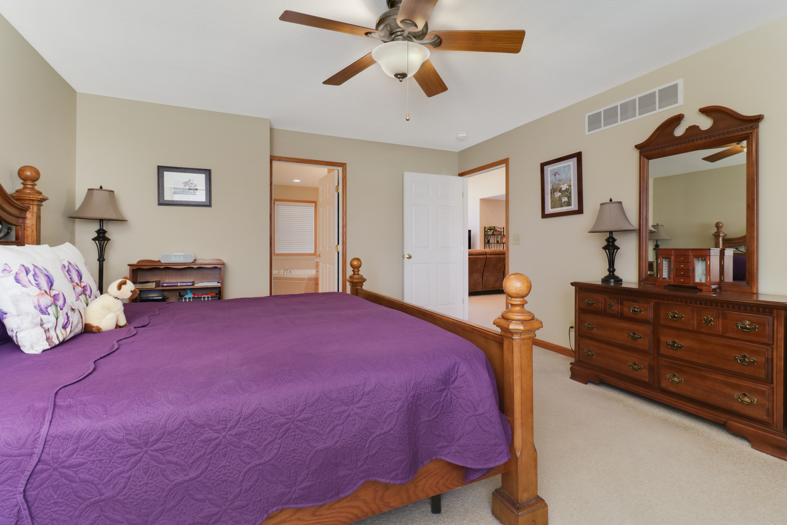 2374 Heather Ridge Drive Normal, IL 61761 - Photo 17 of 31 a bedroom with a bed and a dresser