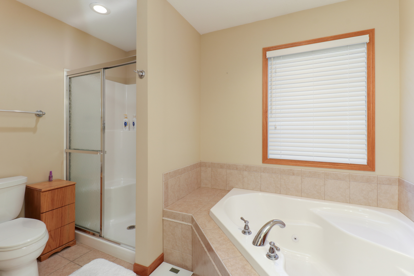 2374 Heather Ridge Drive Normal, IL 61761 - Photo 19 of 31 a bathroom with a sink a toilet and shower